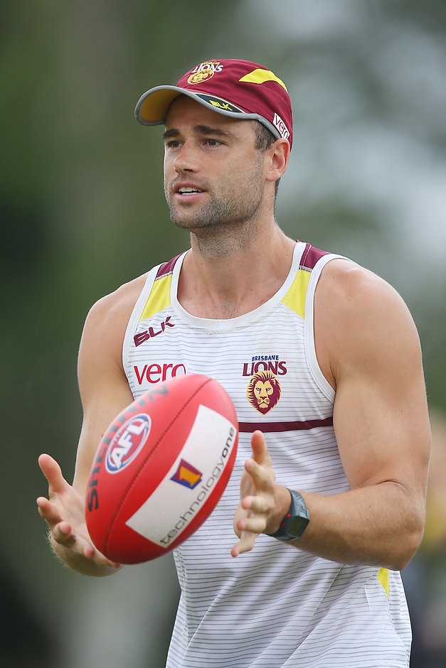 AFL 2016 Training - Brisbane 190216 BRISBANE, AUSTRALIA - FEBRUARY 19: Trent West handballs during a Brisbane Lions AFL training session at Giffin Park on February 19, 2016 in Brisbane, Australia. (Photo by Chris Hyde/Getty Images/AFL Media)